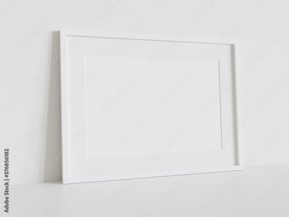 White frame leaning on white floor in interior mockup. Template of a picture framed on a wall 3D rendering White frame leaning on white floor in interior mockup. Template of a picture framed on a wall 3D rendering