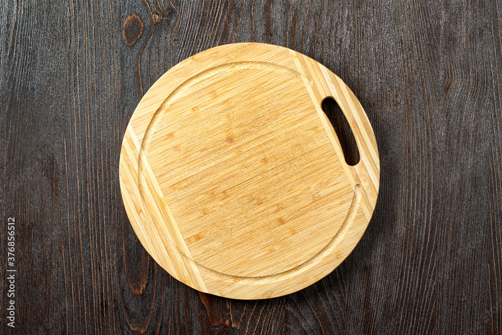 Top view of a round wooden cutting board Top view of a round wooden cutting board