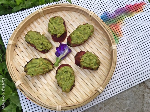 Purple potato with avocadoes mousse and mustard