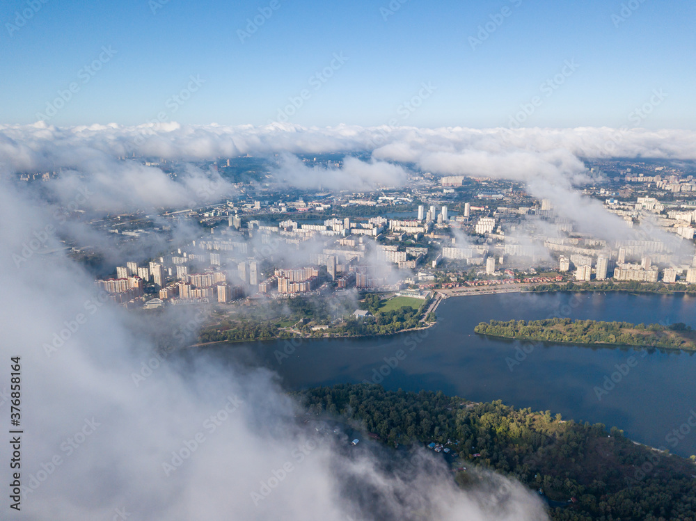 Fototapeta premium Flying over autumn clouds in Kiev. Sunny morning.