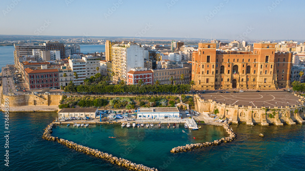 Governament Palace in the Center of Taranto, in the South of Italy and the waterfront of the city from  panoramic aerial view photo from flying drone.Taranto, Puglia, Italy (Series)