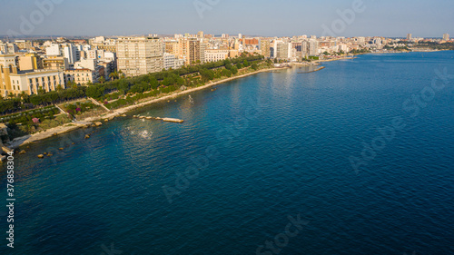 Governament Palace in the Center of Taranto, in the South of Italy and the waterfront of the city from  panoramic aerial view photo from flying drone.Taranto, Puglia, Italy (Series) photo