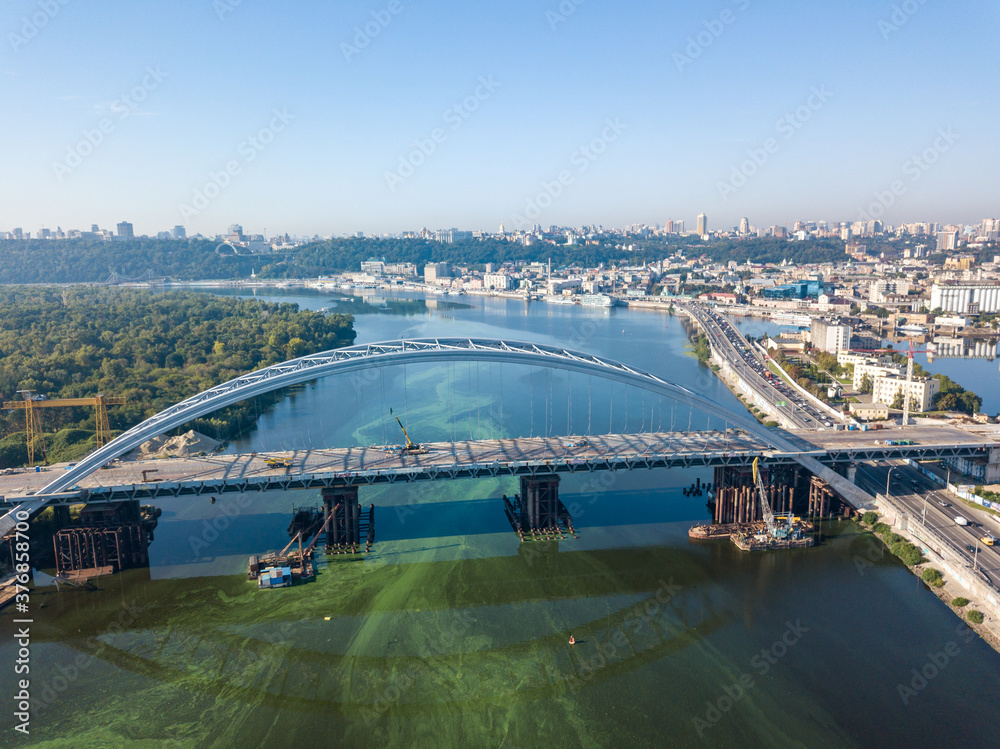 Obraz premium Aerial drone view. A cable-stayed bridge under construction across the Dnieper River in Kiev.