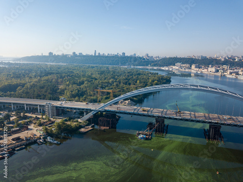 Aerial drone view. A cable-stayed bridge under construction across the Dnieper River in Kiev.