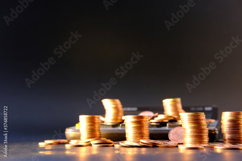 stacks of coins on a black background