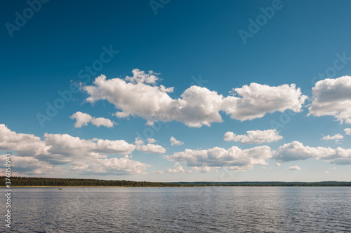Vuoksa river near Imatra in the Leningrad region, Russia. Coastline with pine forest reflected in Vuoksa water, near Finland. River bank