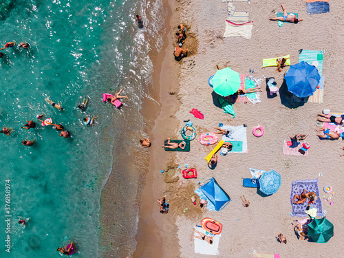 Aerial Beach Photography, People And Colorful Umbrellas On Seaside Beach