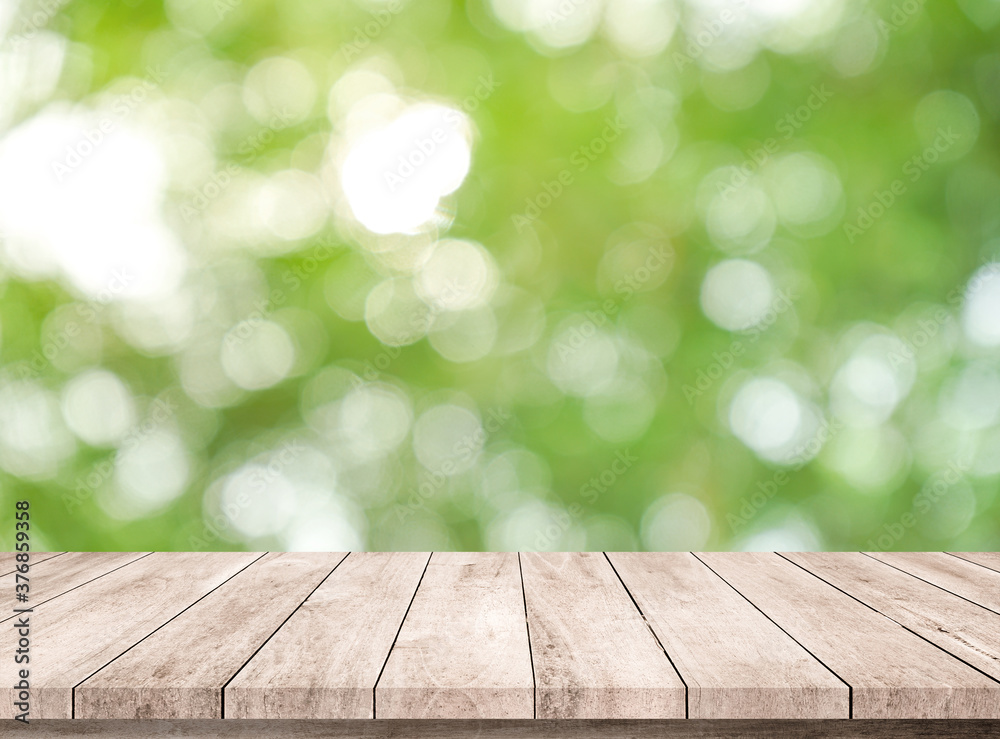 wood table with abstract green bokeh background wood table with abstract green bokeh background