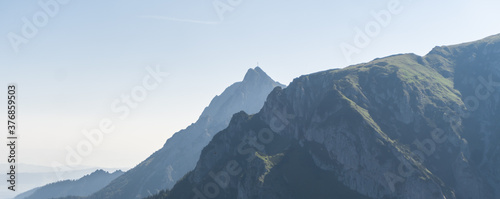 Panoramic view of the Polish Tatra peaks of the mountains during summer morning.