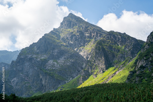 Fototapeta Naklejka Na Ścianę i Meble -  Panoramic view of the Polish Tatra peaks of the mountains during summer morning.