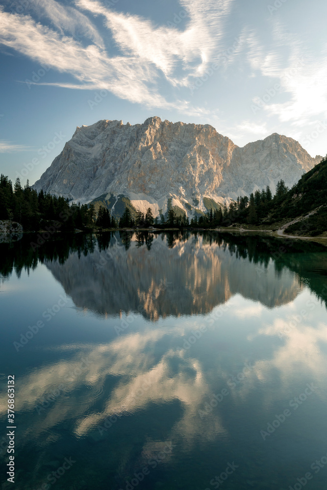 Mountain Zugspitze at sunrise with reflections on lake Seebensee near Ehrwald, reutte, Tirol. Beautiful morning, hiking, mount