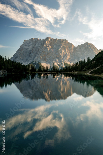 Mountain Zugspitze at sunrise with reflections on lake Seebensee near Ehrwald, reutte, Tirol. Beautiful morning, hiking, mount