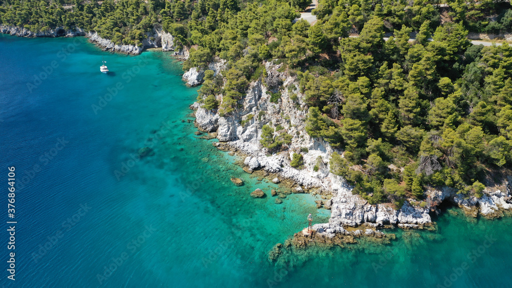 Aerial drone photo of beautiful cave with crystal clear turquoise sea in island of Skopelos visited by boat, Sporades, Greece
