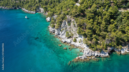 Aerial drone photo of beautiful cave with crystal clear turquoise sea in island of Skopelos visited by boat, Sporades, Greece © aerial-drone