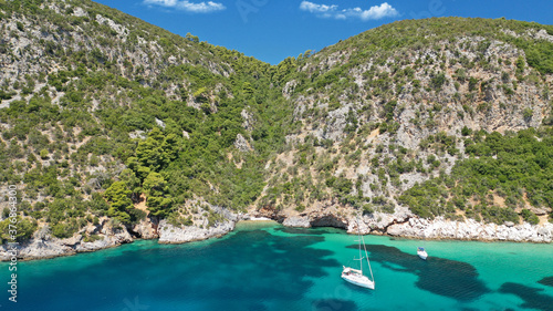 Aerial drone photo of popular crystal clear turquoise beach of Limnonari a safe sail boat anchorage, Skopelos island, Sporades, Greece