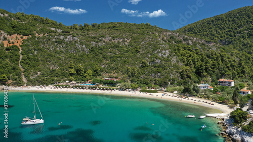 Aerial drone photo of popular crystal clear turquoise beach of Limnonari a safe sail boat anchorage, Skopelos island, Sporades, Greece © aerial-drone