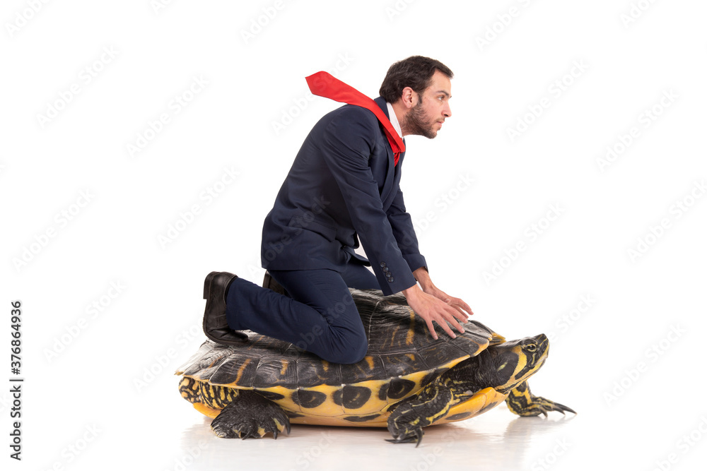 Businessman riding a turtle