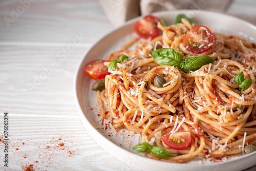 spaghetti with tomato sauce, basil and parmesan