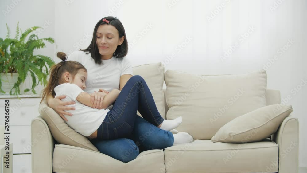 4k slowmotion video of cute little daughter having fun with adult mother. 4k slowmotion video of cute little daughter having fun with adult mother.