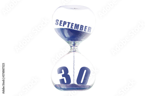 september 30th. Day 30 of month,Hour glass and calendar concept. Sand glass on white background with calendar month and date. schedule and deadline autumn month, day of the year concept