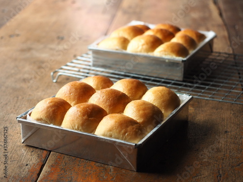 Dinner bread rolls in square baking tin molds