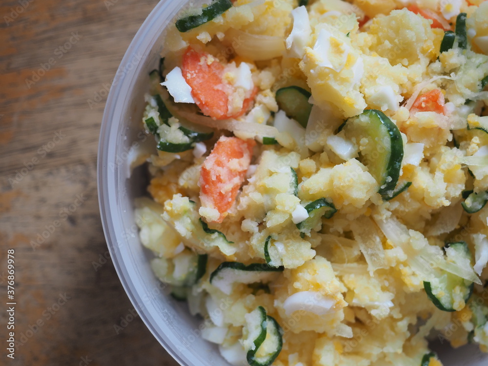 Japanese style potato salad with boiled egg, pickled cucumber, onion and carrot Japanese style potato salad with boiled egg, pickled cucumber, onion and carrot