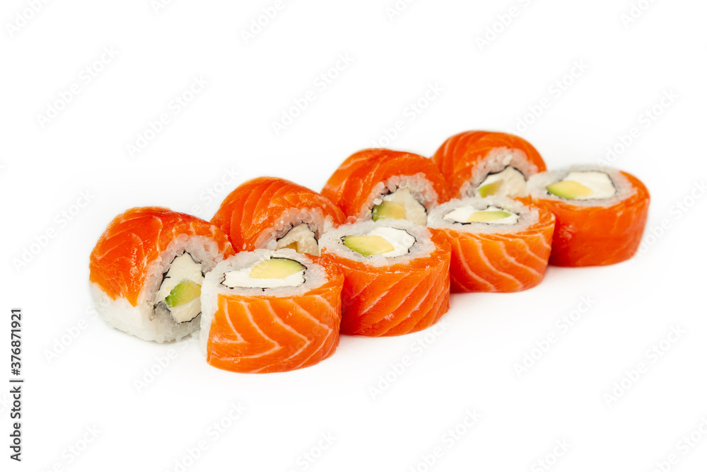 Sushi roll Philadelphia with avocado on a white plate, classic Japanese sushi. Traditional Japanese food with maki. Delicious pieces of sushi. For the restaurant menu. copyspace Sushi roll Philadelphia with avocado on a white plate, classic Japanese sushi. Traditional Japanese food with maki. Delicious pieces of sushi. For the restaurant menu. copyspace