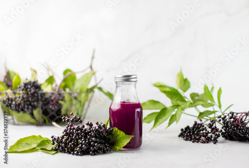 Elderberry syrup in a bottle, front view