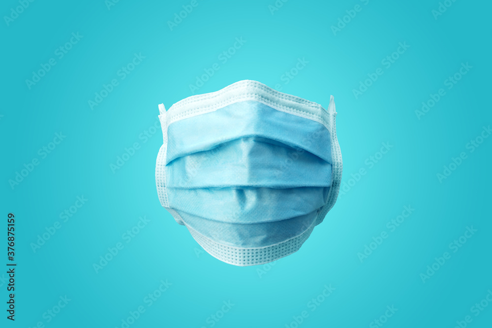 A plain blue medical Surgical protection face mask. Front facing view. A plain blue medical Surgical protection face mask. Front facing view.