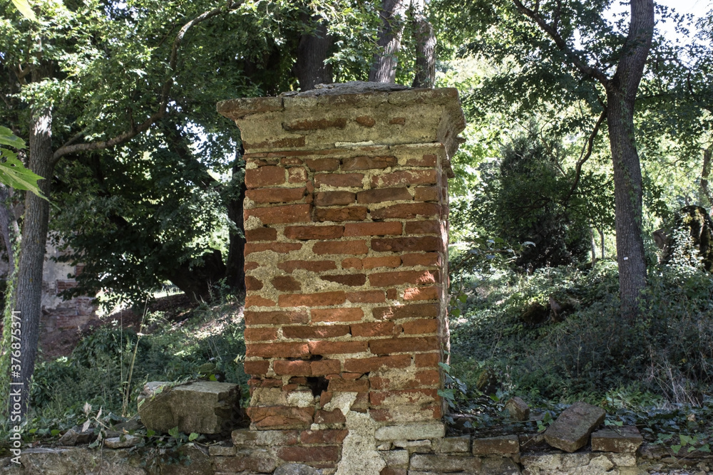 A brick fence post