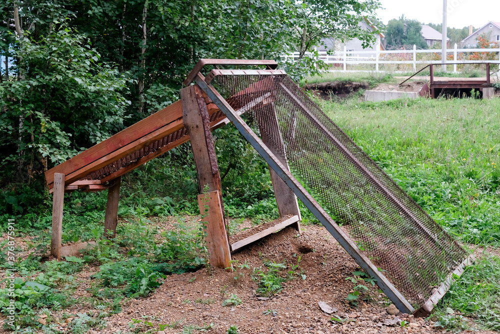 Sand sieve at a construction site. Homemade construction Sand sieve at a construction site. Homemade construction