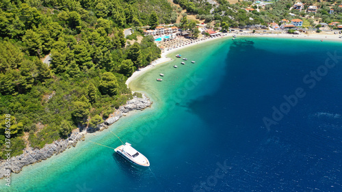 Aerial drone photo of famous crystal clear turquoise beach and bay of Panormos a popular safe sail boat anchorage in island of Skopelos, Sporades, Greece photo