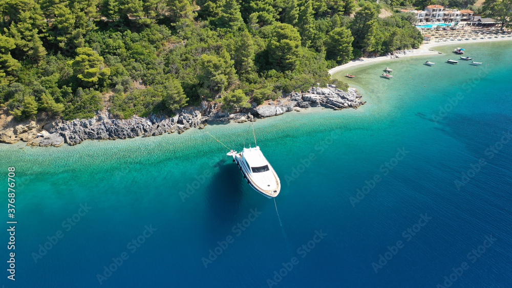 Obraz premium Aerial drone photo of luxury yacht anchored in tropical exotic island bay with turquoise sea