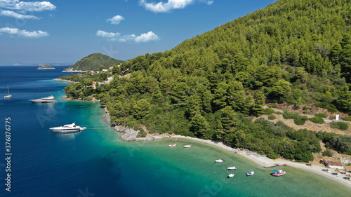 Fototapeta Naklejka Na Ścianę i Meble -  Aerial drone photo of famous crystal clear turquoise beach and bay of Panormos a popular safe sail boat anchorage in island of Skopelos, Sporades, Greece