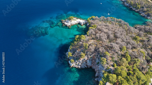 Aerial drone photo of famous from Mamma Mia movie Three pine cape Amarantos a trully scenic place with crystal clear sea, Skopelos island, Sporades, Greece