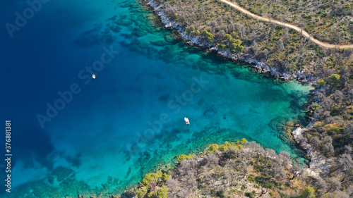 Aerial drone photo of famous from Mamma Mia movie Three pine cape Amarantos a trully scenic place with crystal clear sea, Skopelos island, Sporades, Greece