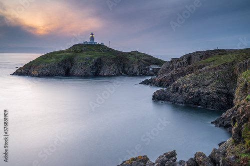 Strumble Head Lighthouse, Pembrokeshire, at sunset © parkerspics