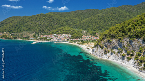 Aerial drone photo of small fishing village of Neo Klima with nearby popular beach of Hovolos, Skopelos island, Sporades, Greece photo