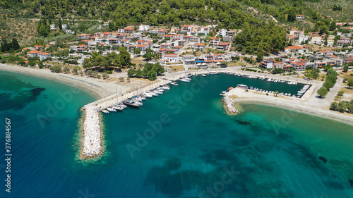 Aerial drone photo of small fishing village of Neo Klima with nearby popular beach of Hovolos, Skopelos island, Sporades, Greece photo
