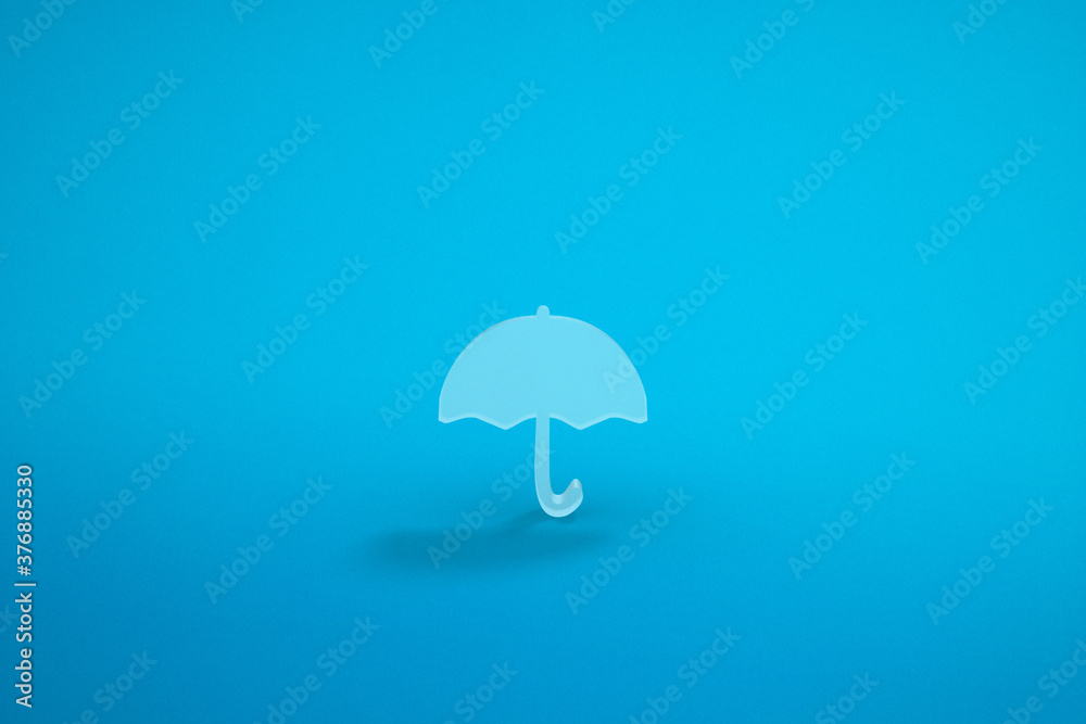 An umbrella icon in a blue background. 3D rendering.