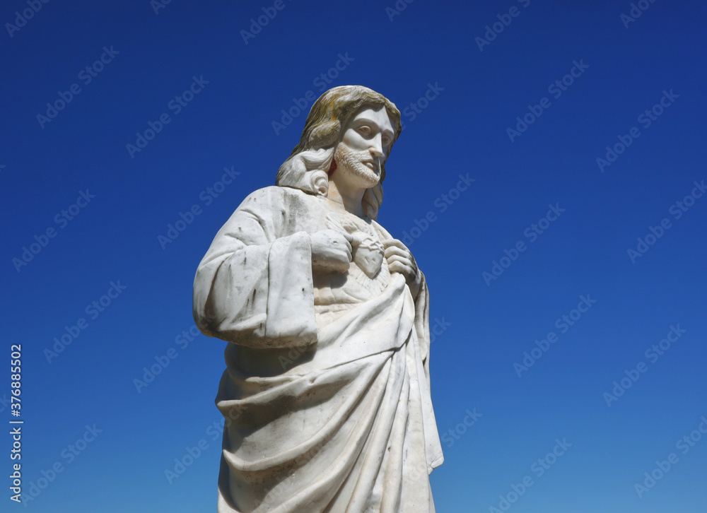 Old stone catholic Jesus Christ statue Old stone catholic Jesus Christ statue