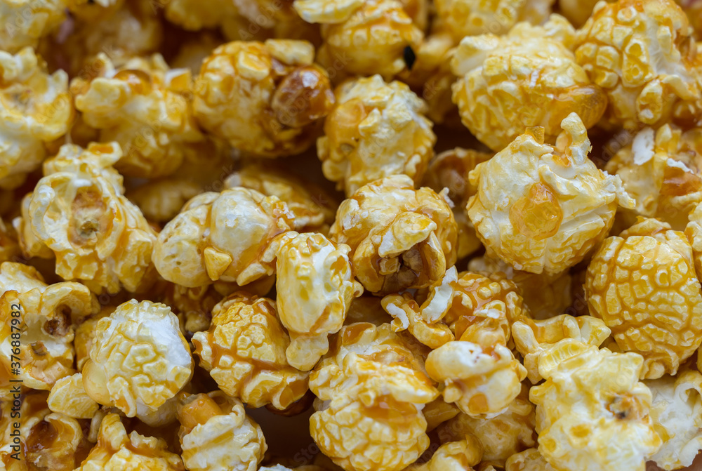 Popcorn with caramel - food background. Selective focus. Popcorn with caramel - food background. Selective focus.