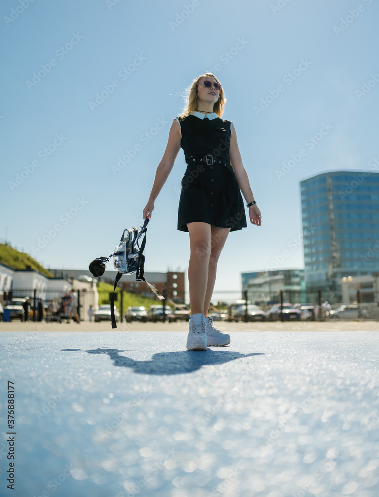 Woman in dress enjoys sun in summertime. Woman in dress enjoys sun in summertime.