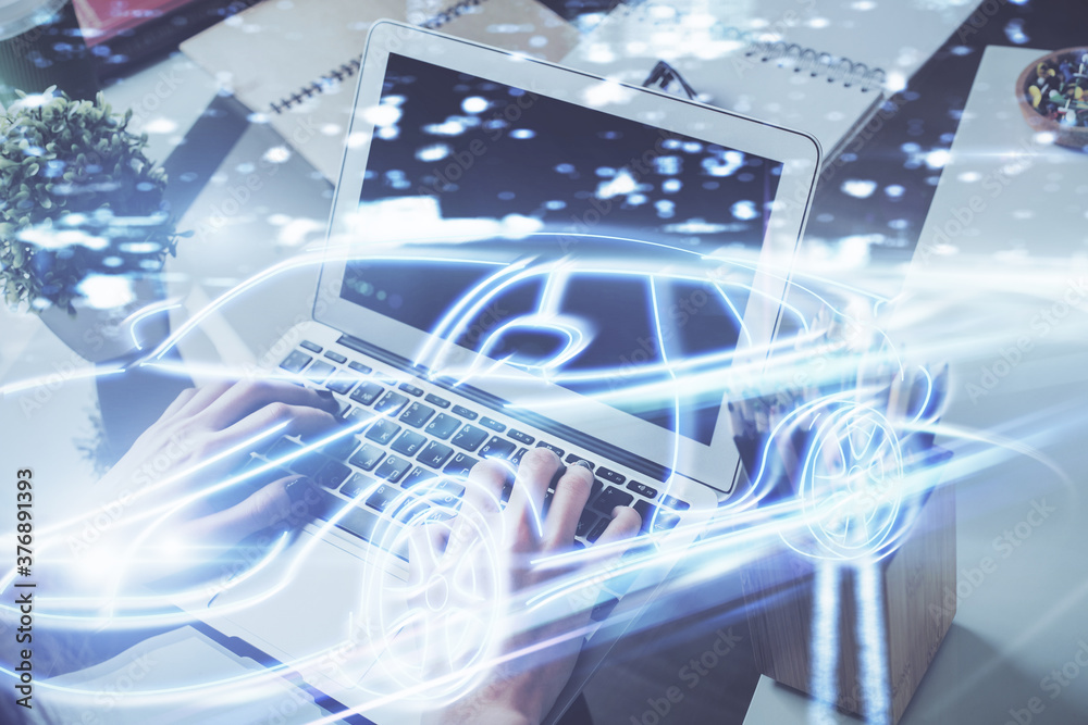 Automobile theme drawing with businessman working on computer on background. Autopilot taxi concept. Double exposure. Automobile theme drawing with businessman working on computer on background. Autopilot taxi concept. Double exposure.