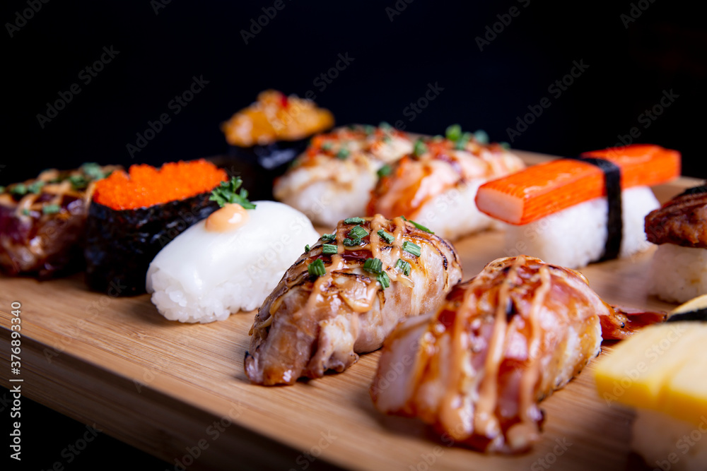 Japanese sushi set , Sushi nigiri rolls and sashimi served in japanese food restaurant menu Japanese sushi set , Sushi nigiri rolls and sashimi served in japanese food restaurant menu