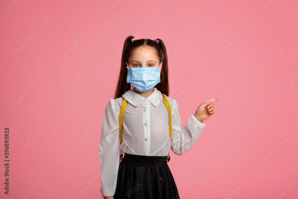 Education during quarantine covid. Child girl in uniform and protective mask Education during quarantine covid. Child girl in uniform and protective mask