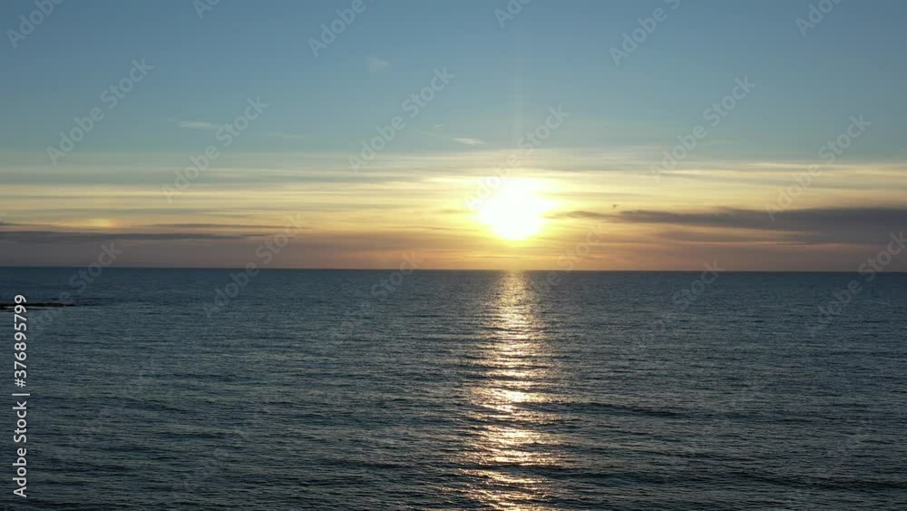 Clean simple aerial view of a sunset / sunrise over the ocean Clean simple aerial view of a sunset / sunrise over the ocean