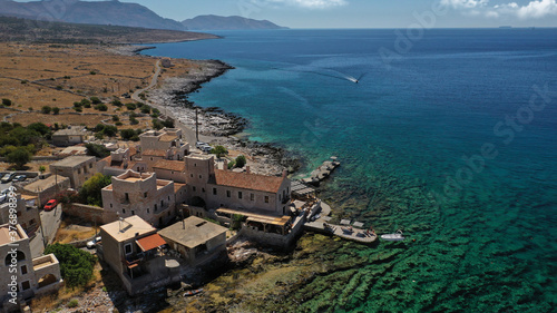 Aerial drone photo of picturesque fishing village of Gerolimenas with crystal clear emerald sea and traditional Lakonian architecture, Mani peninsula, Peloponnese, Greece photo