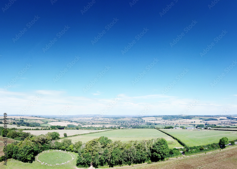 landscape image of the rollright stone in the countryside