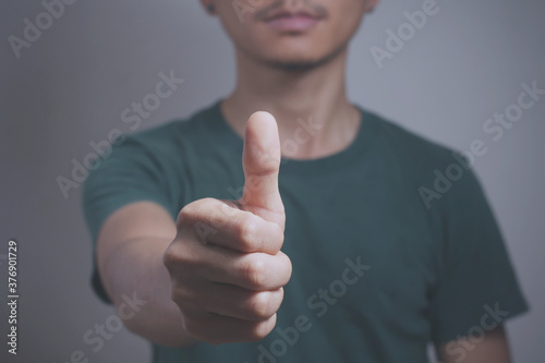 man hand with thumb up. Like and Satisfaction concept.